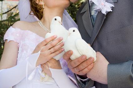 Bride and Groom preparing to release doves